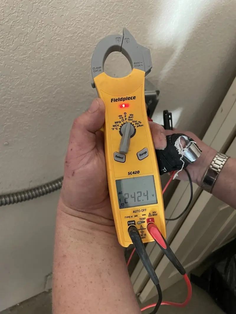 Voltage testing with clamp meter during Electrical Installation Services in South Miami Heights